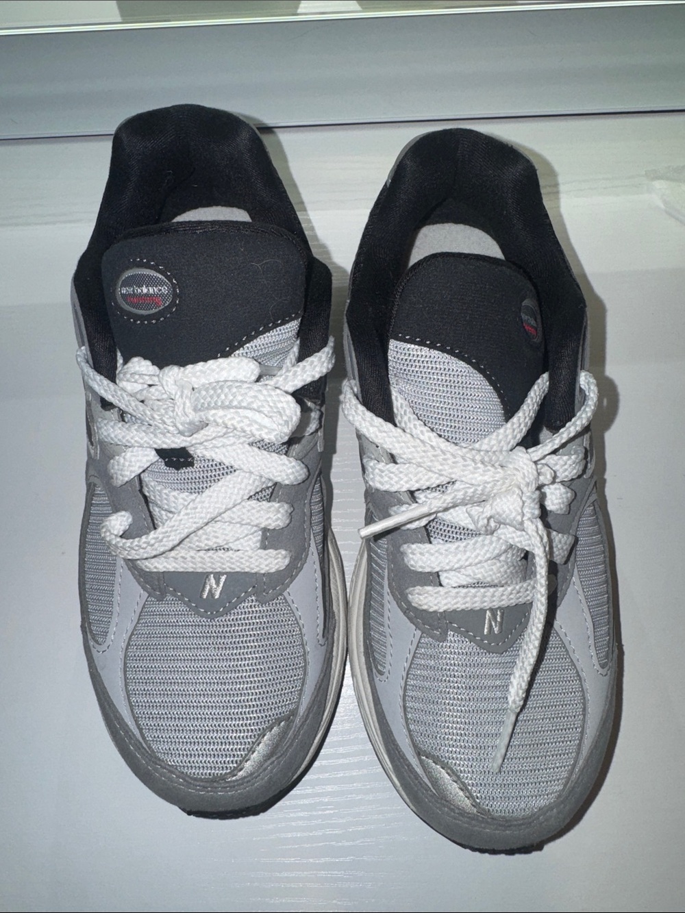 New Balance Kids Gray and White Sneakers